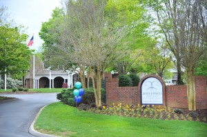 Apartments in Knoxville, Tennessee - Entrance to Community with Sign and Trees